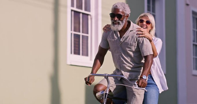 Cheerful, senior couple and travel with bicycle for riding, adventure and exploring on vacation together. City street, woman and man with bike for cycling, connection and bonding or smile in marriage