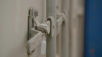 Close up of a metal lock on a storage container, showcasing its design and function. Stock Footage