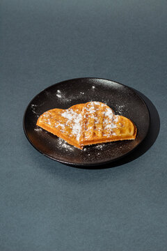 heart shaped waffles on a dark plate. Waffle day. baked waffles
