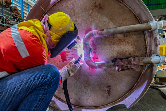 Industrial welding fabricated pipeline is tank stainless steel repair construction work in factory, Welding process by Gas Tungsten Arc Welding