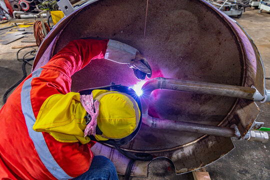 Industrial welding fabricated pipeline is tank stainless steel repair construction work in factory, Welding process by Gas Tungsten Arc Welding