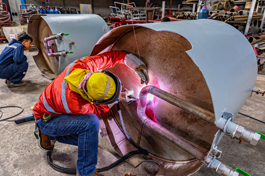 Industrial welding fabricated pipeline is tank stainless steel repair construction work in factory, Welding process by Gas Tungsten Arc Welding