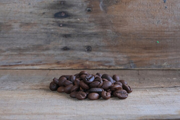 Coffee beans on a wooden background