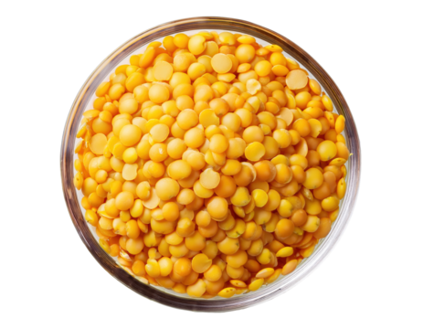 A close-up of dried yellow split peas in a clear bowl, showcasing their vibrant color and texture, ideal for cooking and healthy recipes. on transparent background