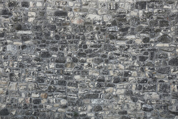 old stone rock wall texture as background. White grey gray granite stone wall pattern texture background. Kalemegdan fortress, Belgrade, Serbia. historical roman empire building