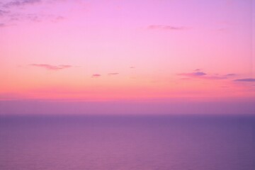 pink and purple sky over the ocean at sunset