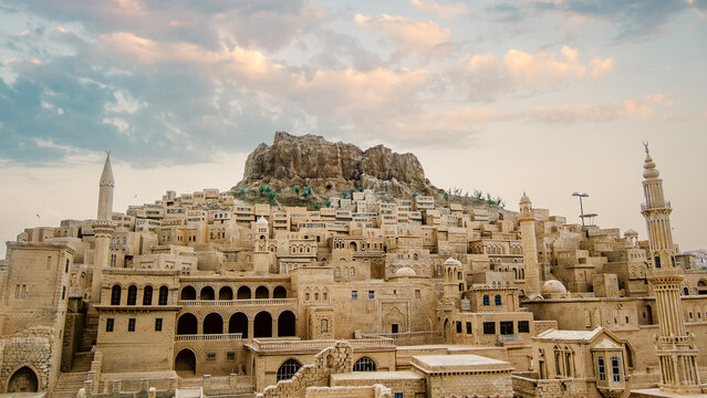 Landscape view of old Mardin city in Turkey with cloudy sky.
