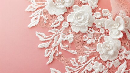 White floral lace on pink fabric.