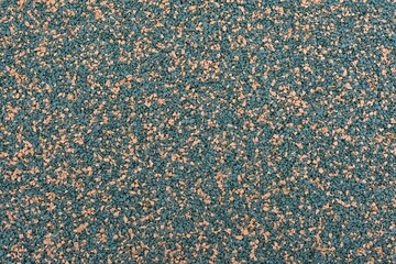 Yellow and green sports field rubber coating close up macro view. Playground paving background...