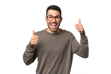 Young handsome caucasian man over isolated background giving a thumbs up gesture