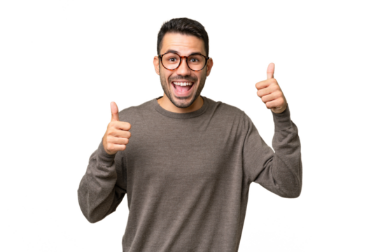 Young handsome caucasian man over isolated background giving a thumbs up gesture