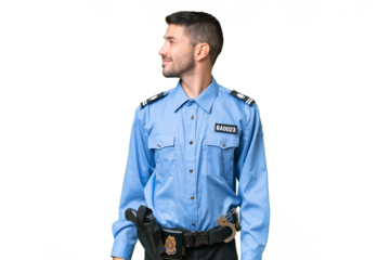 Young police caucasian man over isolated background looking to the side and smiling