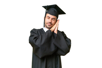 Young university graduate man over isolated background making sleep gesture in dorable expression