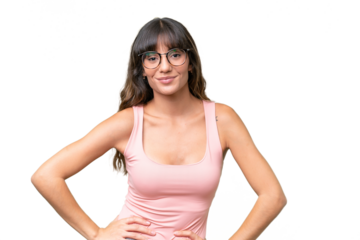 Young caucasian woman over isolated background posing with arms at hip and smiling