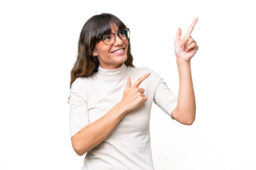 Young caucasian woman over isolated background pointing with the index finger a great idea