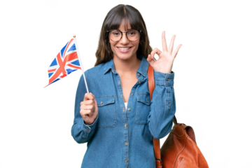 Young caucasian woman holding an United Kingdom flag over isolated background showing ok sign with fingers
