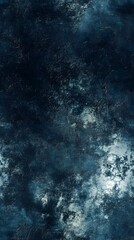 Fototapeta premium Deep indigo textured surface with mottled light spots.