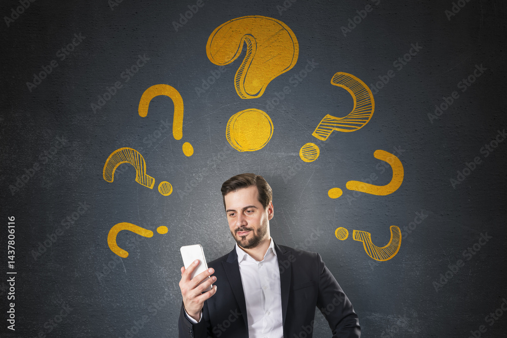 Aufkleber Businessman looking at smartphone surrounded by yellow question marks on dark textured background with abstract light design concept..