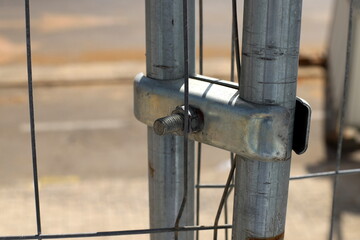 A metal bolt with threads for connecting and fastening parts together.