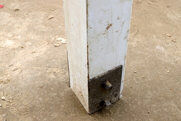 A metal bolt with threads for connecting and fastening parts together.