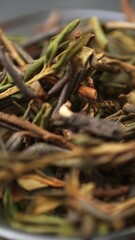 A captivating arrangement of dried herb stems beautifully displayed in a charming bowl. Media