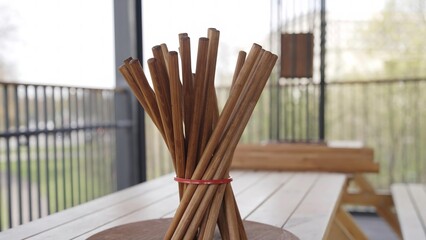 Video shows beautifully arranged chopsticks on a wooden table. Creative