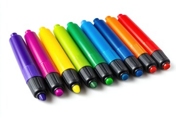 Fototapeta premium Vibrant felt-tip markers arranged in rainbow order with caps off on white background