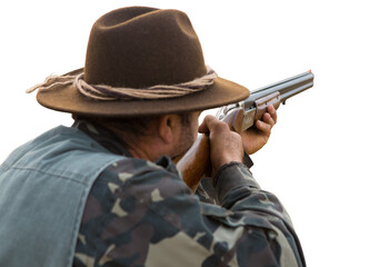 Hunter man in camouflage with a gun during the hunt in search of wild birds or game. Autumn hunting...