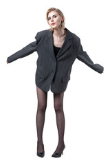 Fototapeta premium Business lady in a suit with amazing long legs in tights in the studio.