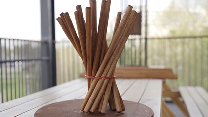 Video shows beautifully arranged chopsticks on a wooden table. Creative