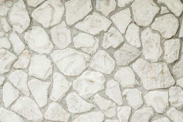 White masonry stone wall background pattern. Wall of an old building or castle