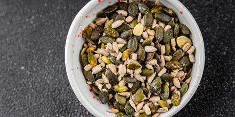 Seed mix pumpkin seeds, sunflower seeds superfood natural food organic fresh tasty gourmet food background on the table rustic food top view copy space