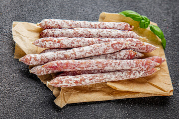 Sausage dried meat aperitif salami natural food dish organic product fresh tasty gourmet food background on the table rustic food top view copy space