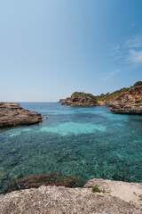 Crystal clear water inviting tourists to swim in mallorca, spain