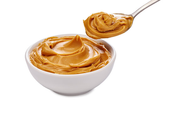 Delicious and Creamy Peanut Butter served in a Bowl accompanied by a Spoon for enjoyment