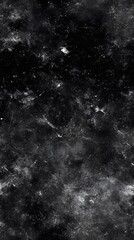 Fototapeta premium Abstract grayscale surface texture with speckled patterns.