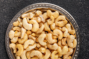 Cashew nuts natural superfood dish organic product fresh tasty gourmet food background on the table rustic food top view copy space