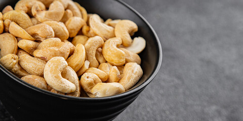 Cashew nuts natural superfood dish organic product fresh tasty gourmet food background on the table rustic food top view copy space