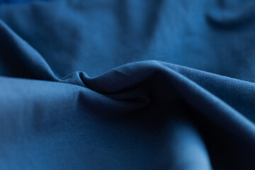 Detailed fabric texture with soft shadows. Close-up shot of textile with a subtle gradient and...