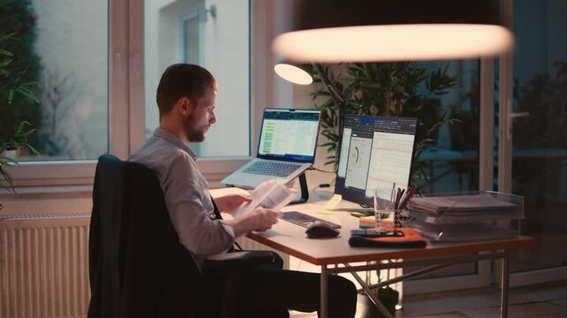 Man Working on Computer in a Modern Office Environment