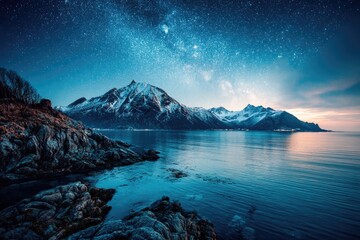Obraz premium Night sky over snowy mountains and sea
