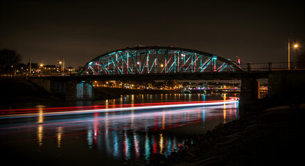 Obraz premium Urban Bridge Illuminated At Night Over River With Long Exposure Lights