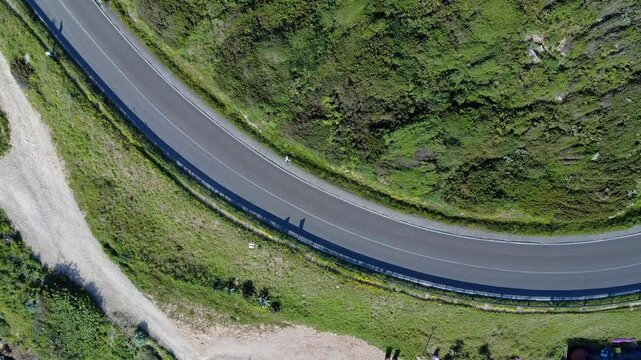 Aerial view of a coastal road curve near Alghero