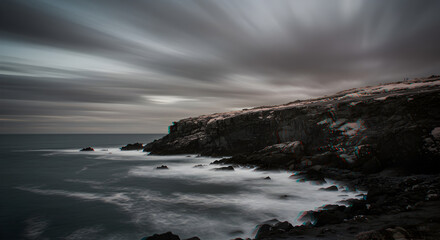 Fototapeta premium Dramatic Cliffside Landscape With Flowing Clouds And Ocean Waves