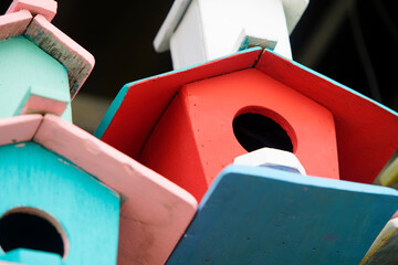 Colorful Wooden Birdhouses Stacked Together in a Creative Arrangement