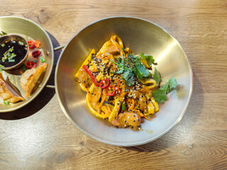 Trying national Asian cuisine in a restaurant