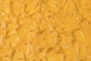 Yellow sauce splashes as a background.