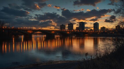 A sunset skyline with glowing skyscrapers, a bridge in the foreground, and golden reflections over the water under soft drifting clouds