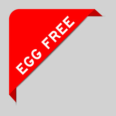 Red color of corner label banner with word egg free on gray background
