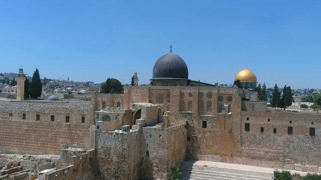 Southern Wall of Temple Mount and dome of the rock, Aerial

Ancient view of the Southern Wall and Al-Aqsa Mosque in the Old City of Jerusalem, featuring historic ruins, stone steps